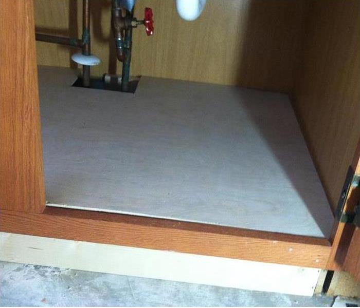 Restored and mitigated kitchen cabinet under sink 