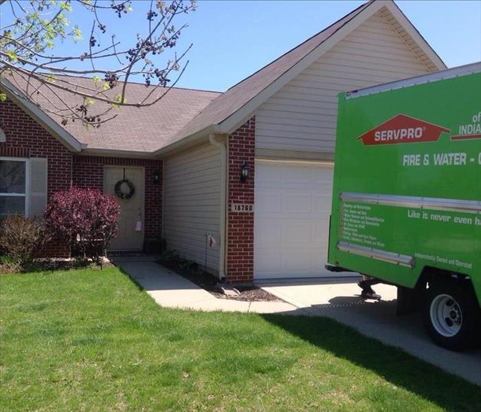 This picture shows a SERVPRO van in front of a house.