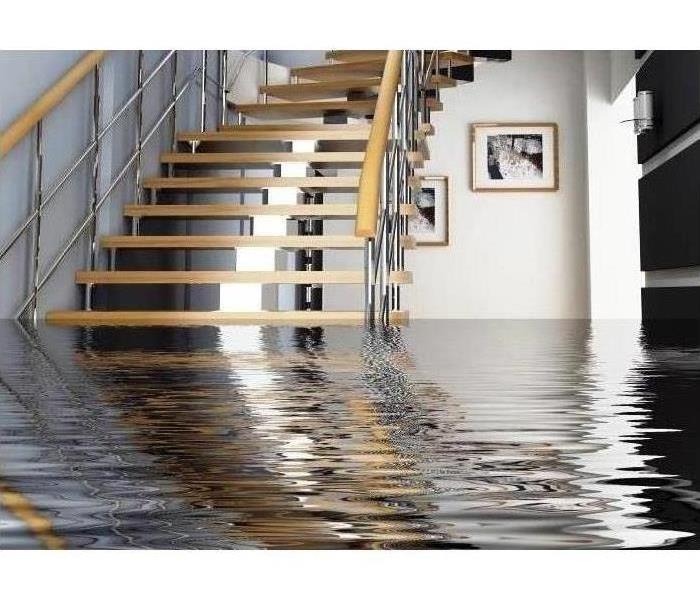 This picture shows a basement flooded with water.